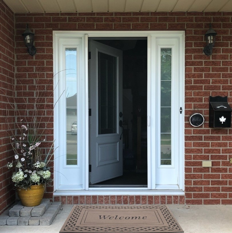 screened in patio with an outdoor rug stylish, cozy design