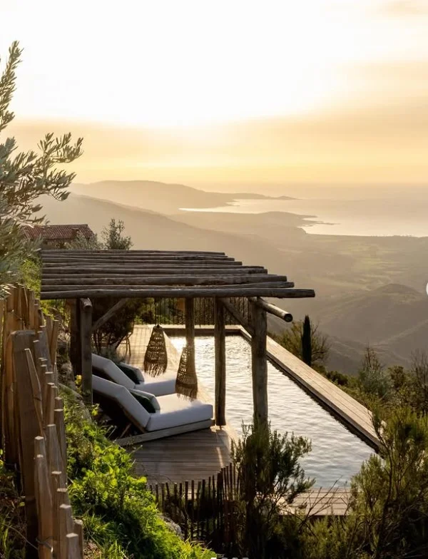 outdoor pergola beside sunken above ground pool area
