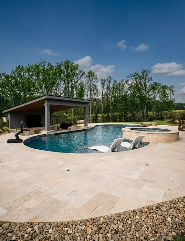 lounge chairs beside stylish sunken above ground pool