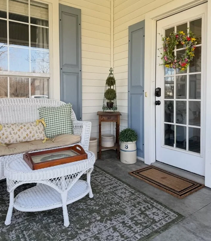 colorful decor accents on small front stoop bright entry