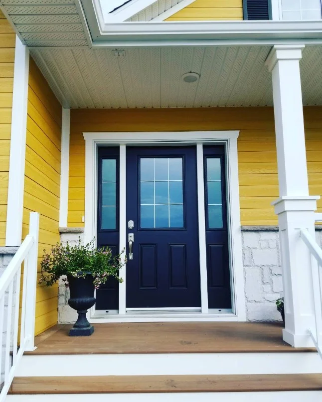 covered front deck entrance with cozy decor