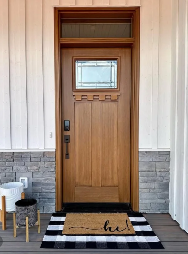 layered outdoor rugs on cozy front deck entrance