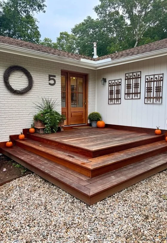 modern house numbers beside front deck entrance