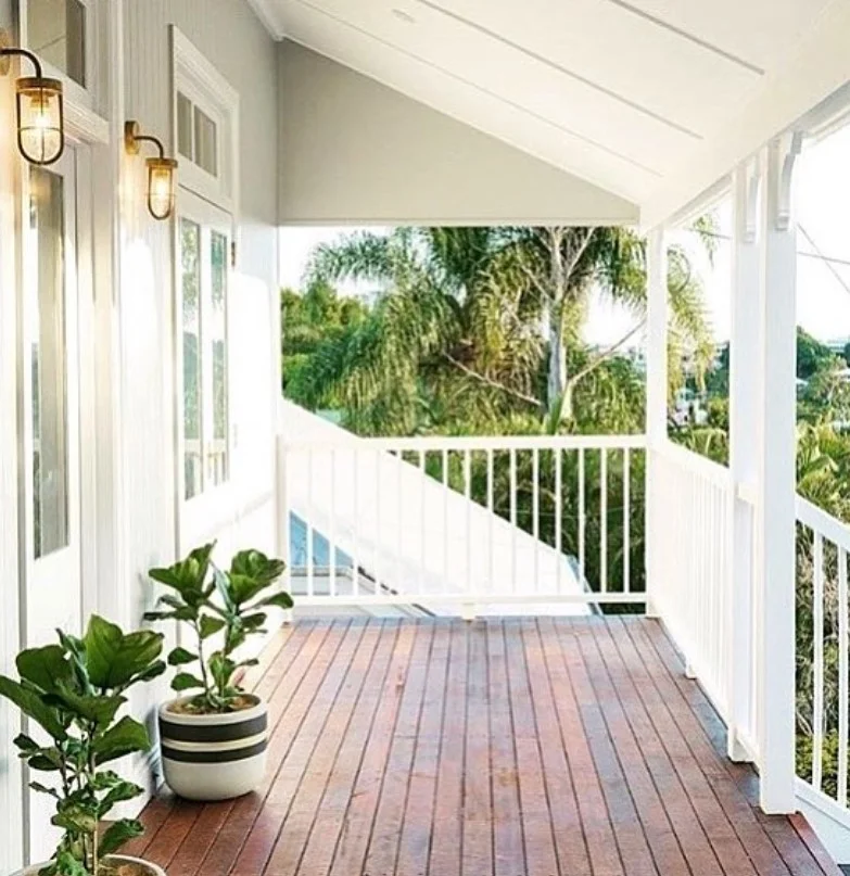 modern wall lighting beside small front deck entrance