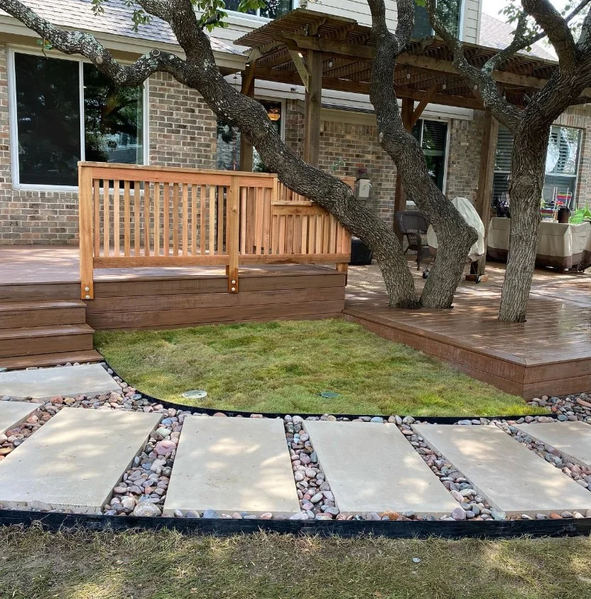 stone landscaping around small front deck design