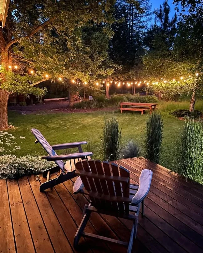outdoor string lights on cozy front deck