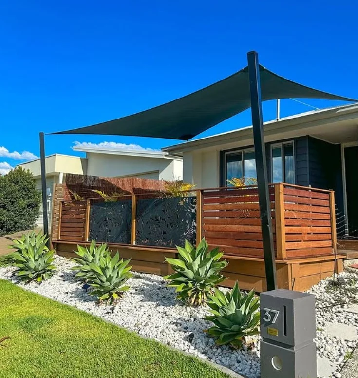 wooden privacy screen beside small front deck