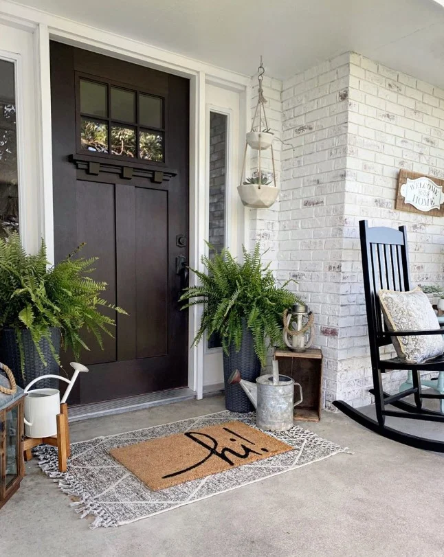 cozy decor on small front porch entrance