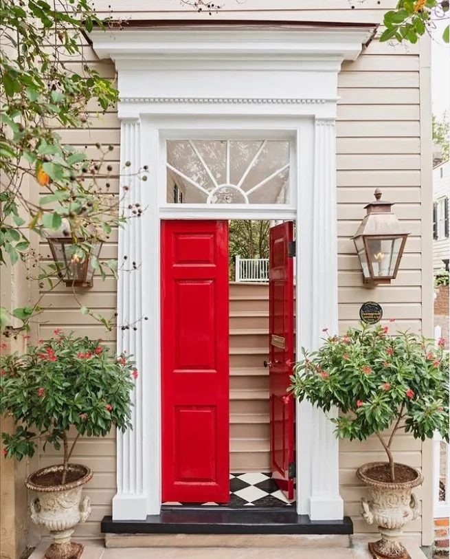 tall planters beside small front entrance exterior