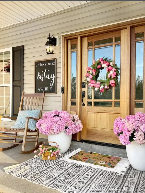 layered doormats on small porch entrance stylish look
