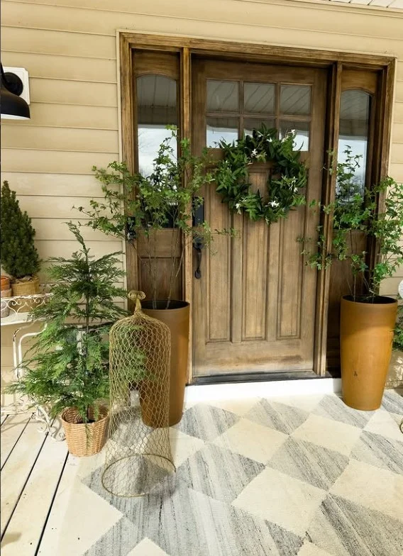 matching planters on small porch entrance balanced design