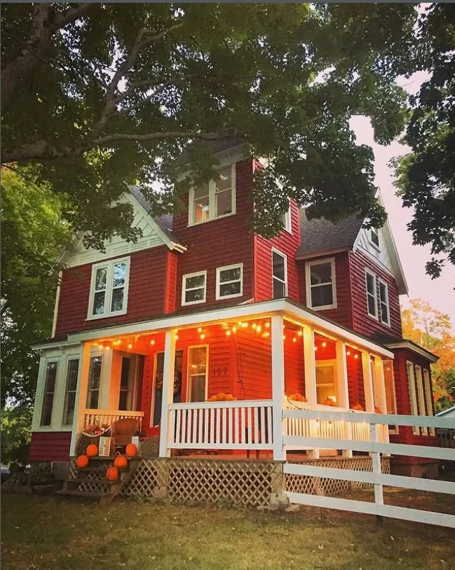 small porch with string lights cozy evening decor