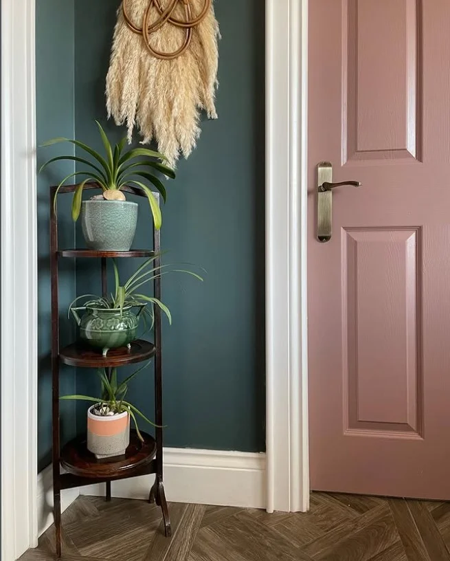 vertical plant stand on small porch entrance saving space