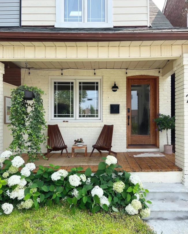 small front stoop with tiny side table decor setup