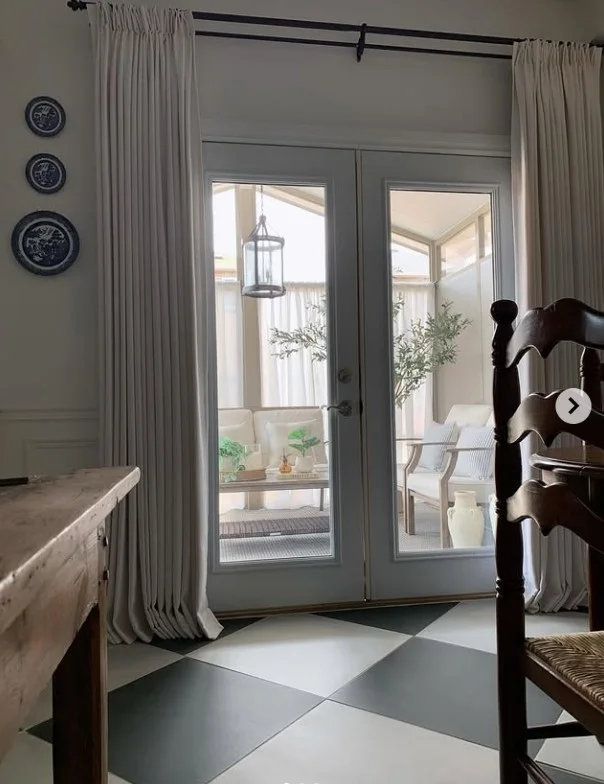 small sunroom with sheer curtains soft natural sunlight