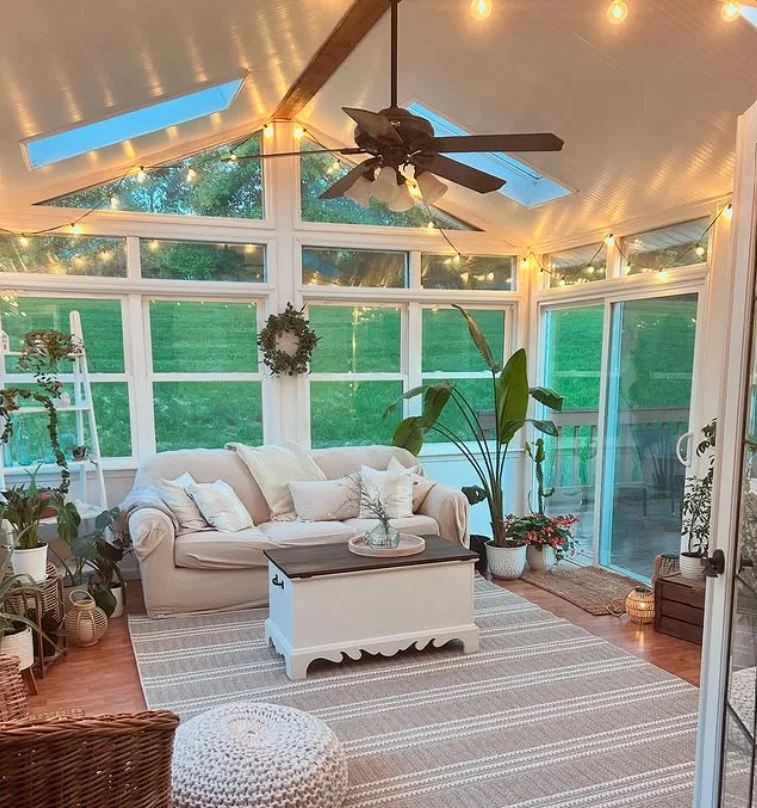 small sunroom with string lights warm relaxing atmosphere
