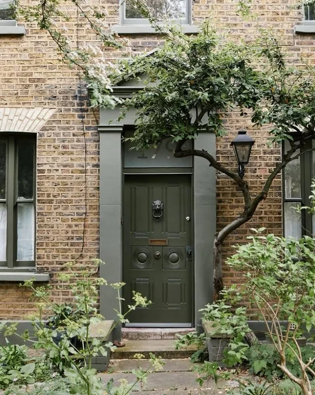 statement door knocker on stylish front door