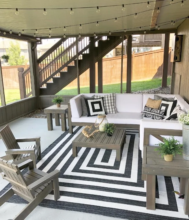 screened patio with throw pillows, comfortable seating area