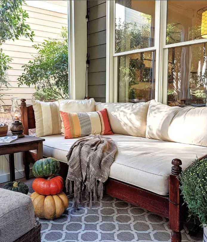 screened porch with decorative throw pillows comfortable seating