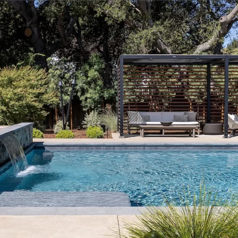 waterfall feature beside luxury sunken above ground pool