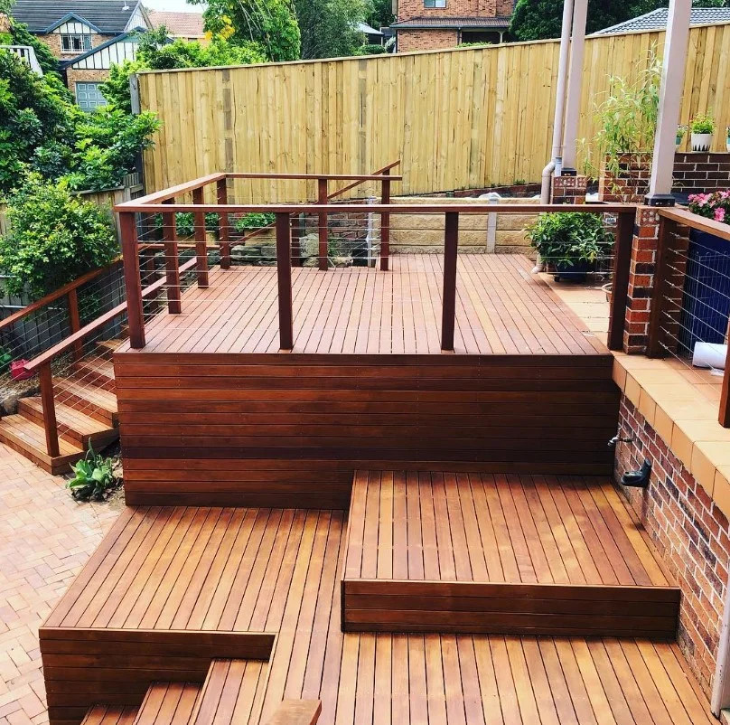 deck renovation featuring new wood railing installation