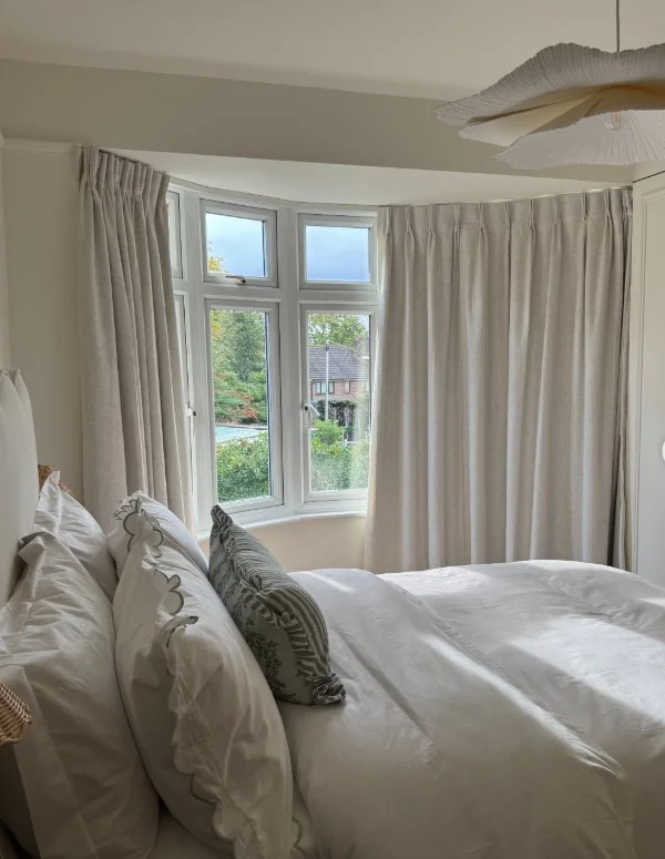 beautiful bay window curtains in bright bedroom design