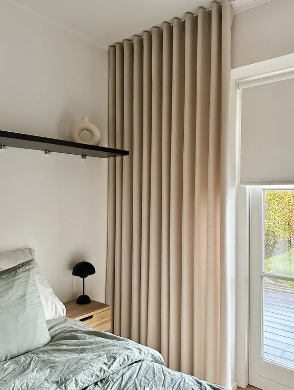 ceiling mounted bedroom curtains creating custom luxury look
