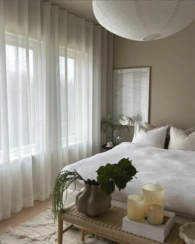 white sheer bedroom curtains with natural sunlight and modern decor