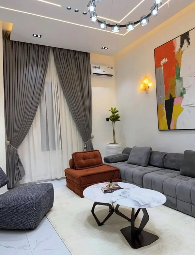 Blackout curtains in a cozy sitting room with neutral décor and natural lighting
