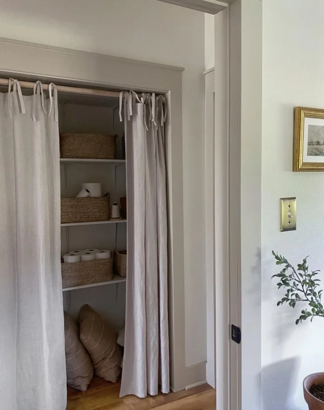 white linen closet curtains in modern bedroom storage area
