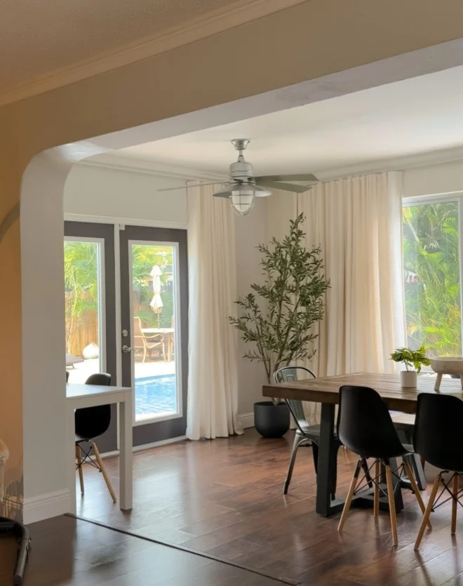light airy white dining room drapes with elegant decor