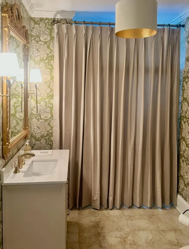 wide shower curtain covering large bathroom wall area