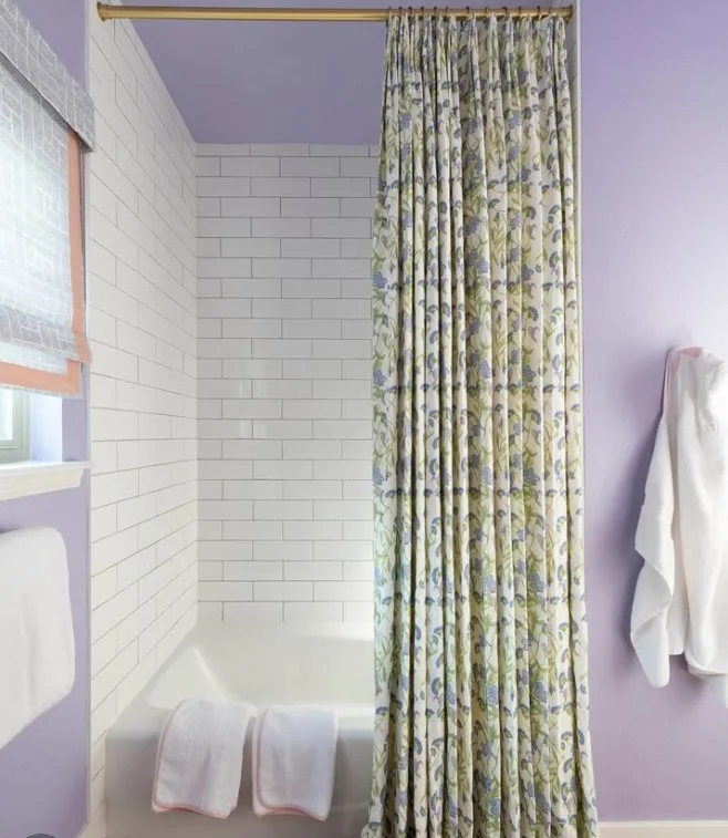 high shower curtain rod installed close to bathroom ceiling