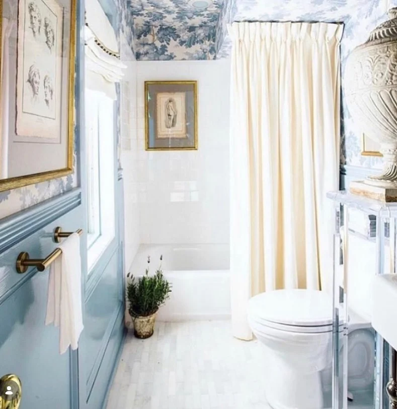 hotel inspired white shower curtain in clean bathroom
