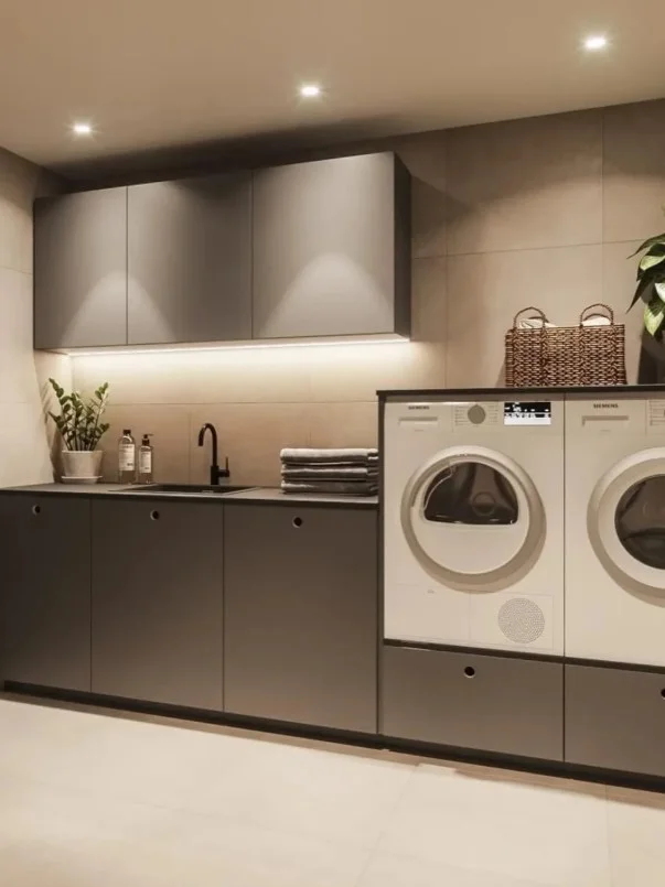 laundry room cabinets with utility sink and storage
