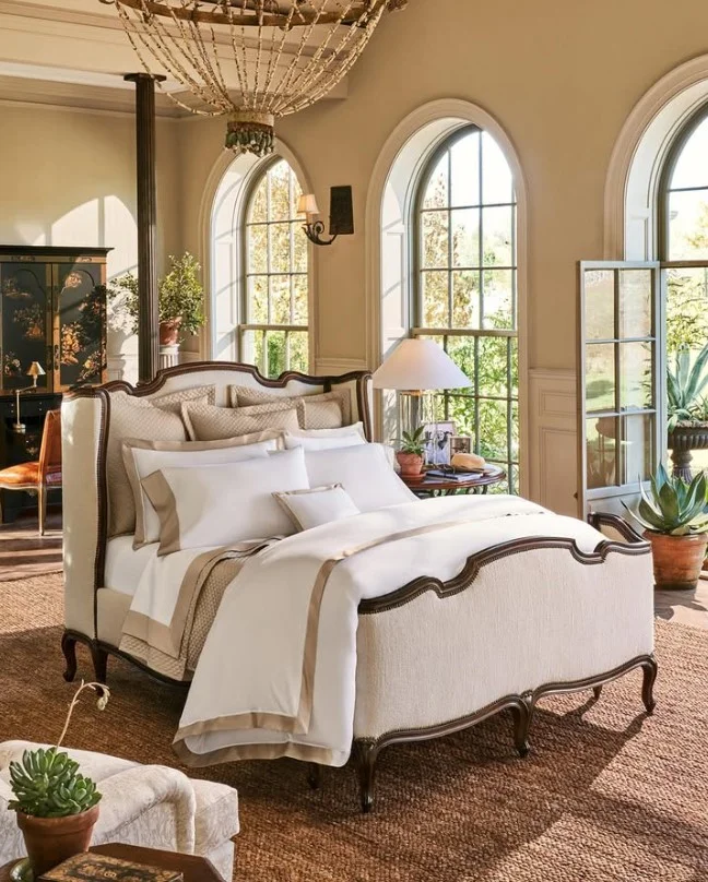 layered luxury bedding with plaid accents in classic bedroom