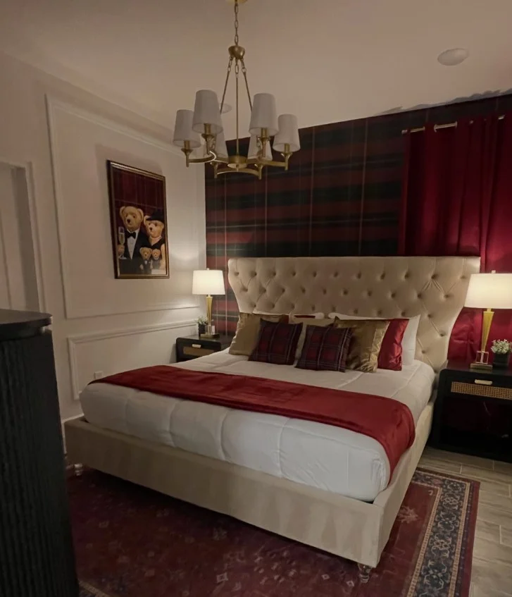 luxury guest bedroom with elegant bedding and warm lighting