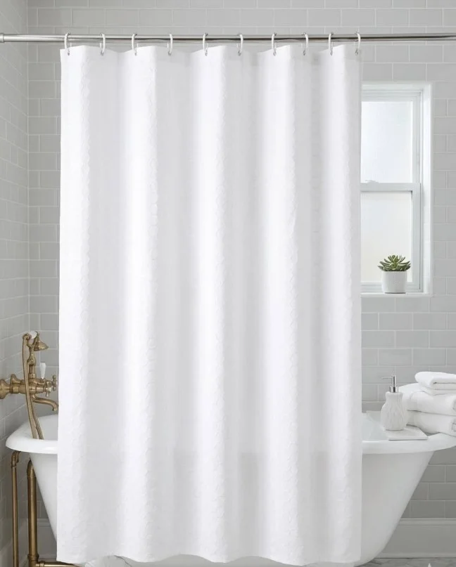minimalist white shower curtain in clean bathroom space