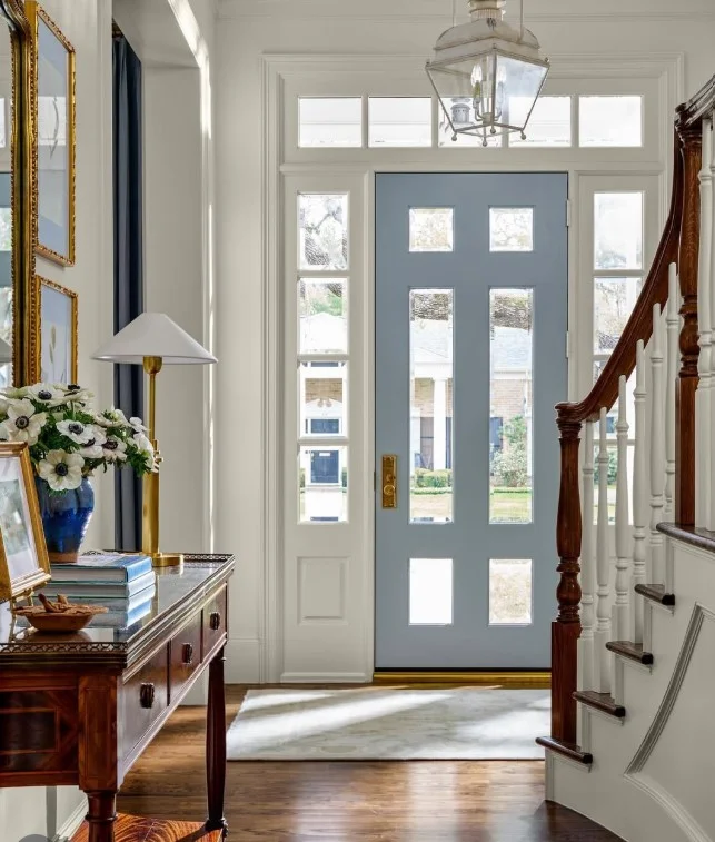 ralph lauren equestrian entryway with horse artwork and wood console table