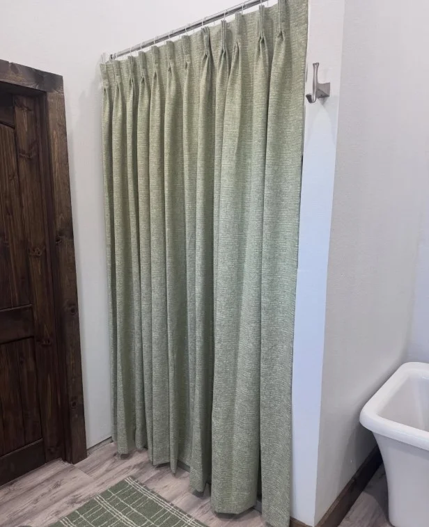 sage green shower curtain with natural bathroom decor