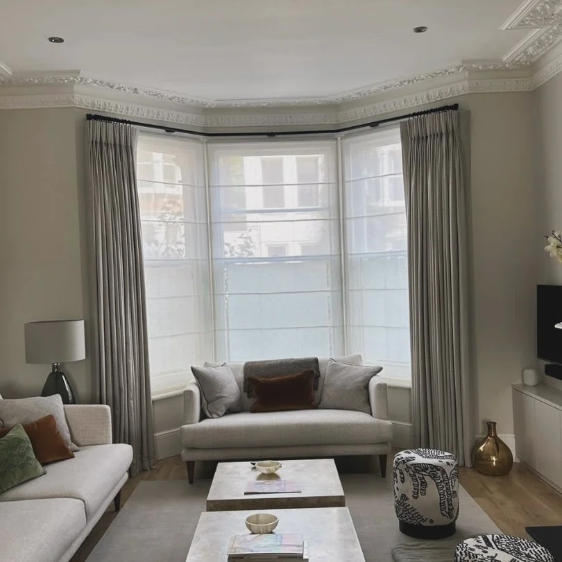 beautiful bay window curtains in stylish sitting room