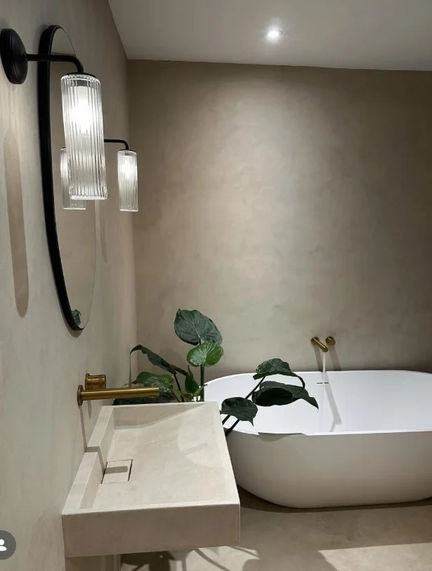stone countertop with wood vanity in japandi bathroom