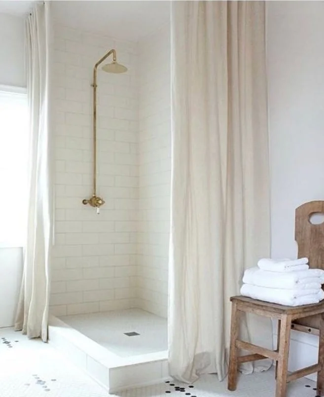floor to ceiling white tall shower curtain in modern bathroom