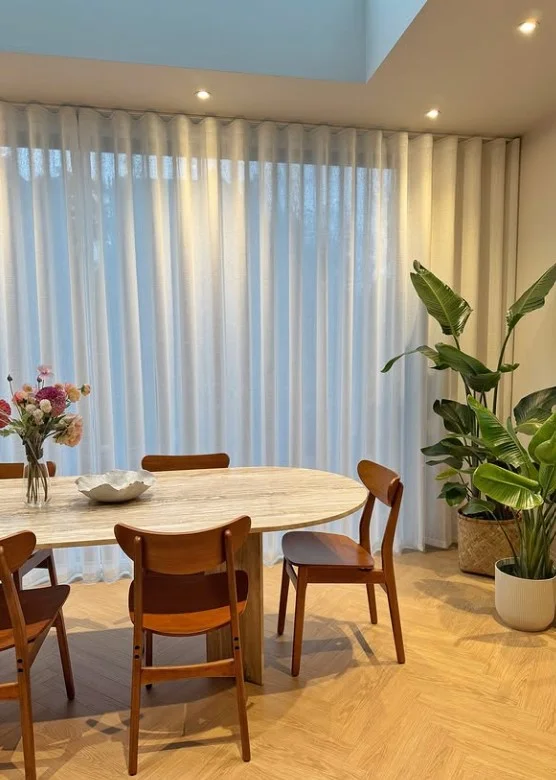 white sheer curtains covering large sliding glass doors