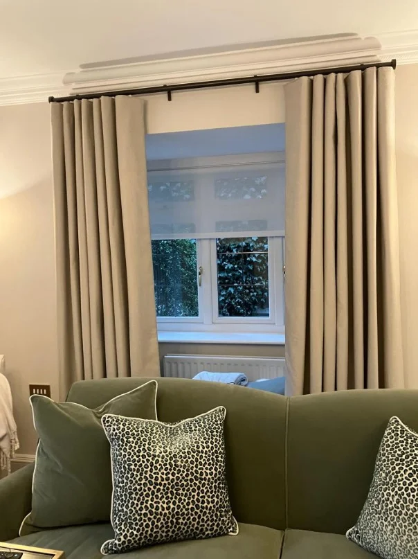 layered sheer and drape curtains in elegant living room