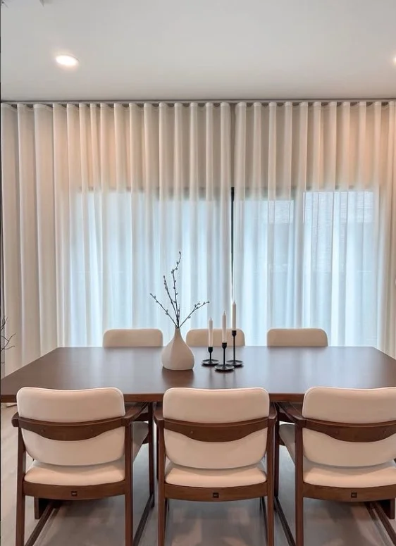 white sheer living room curtains with bright natural sunlight